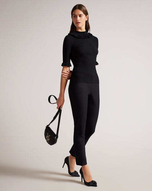 KATELLA-Knitwear-Made of stretchy knit, KATELLA is the perfect statement top to take you from season to season in style. With an oh-so-cute ruffle trim and a super soft feel, this fitted top is sure to become your new go-to. Ted Baker womenswear collection Fitted top Stretch fabric High neck Neck ruffle Ribbed knit Short sleeves with ruffle trim Amy is 5'9.5" / 1.77m and wears Black in a Ted size 1- Ted Baker Romania